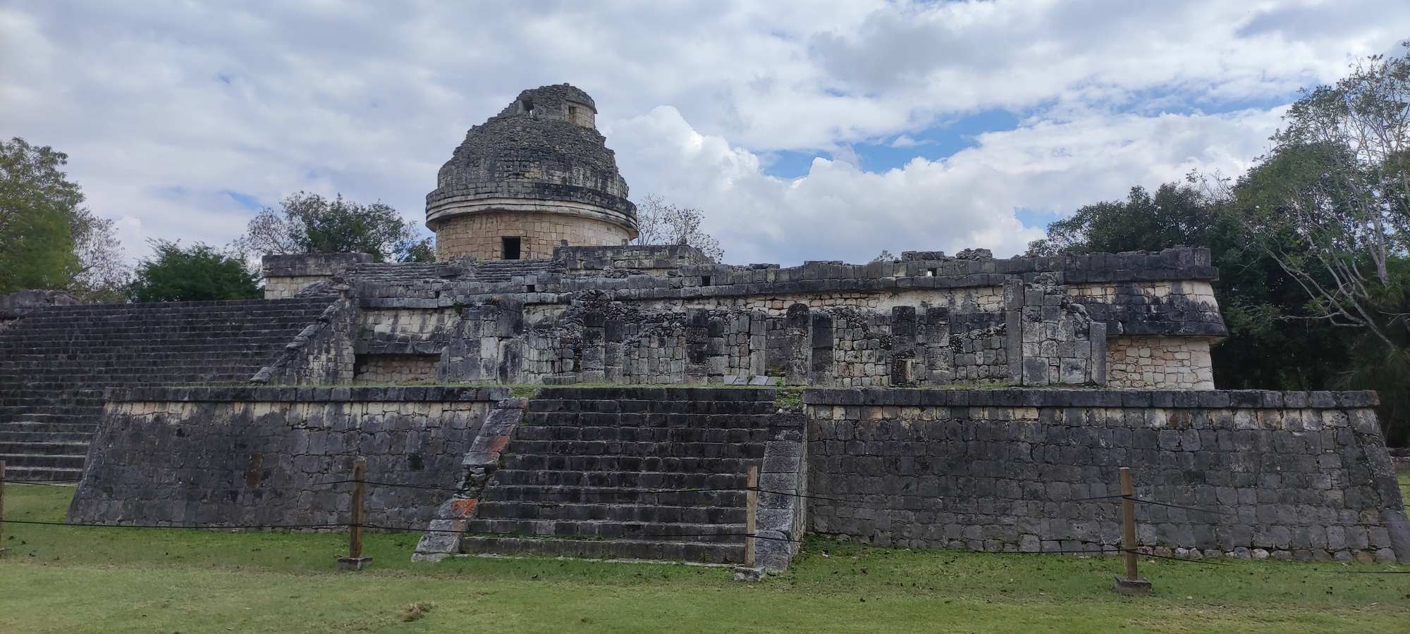 Chichen Itza pyramid El Castillo under blue sky on the Cancun minibus day trip